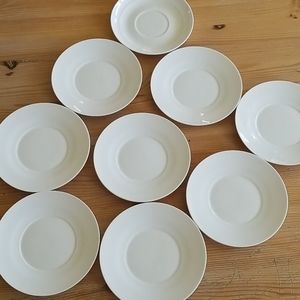 9 white saucers